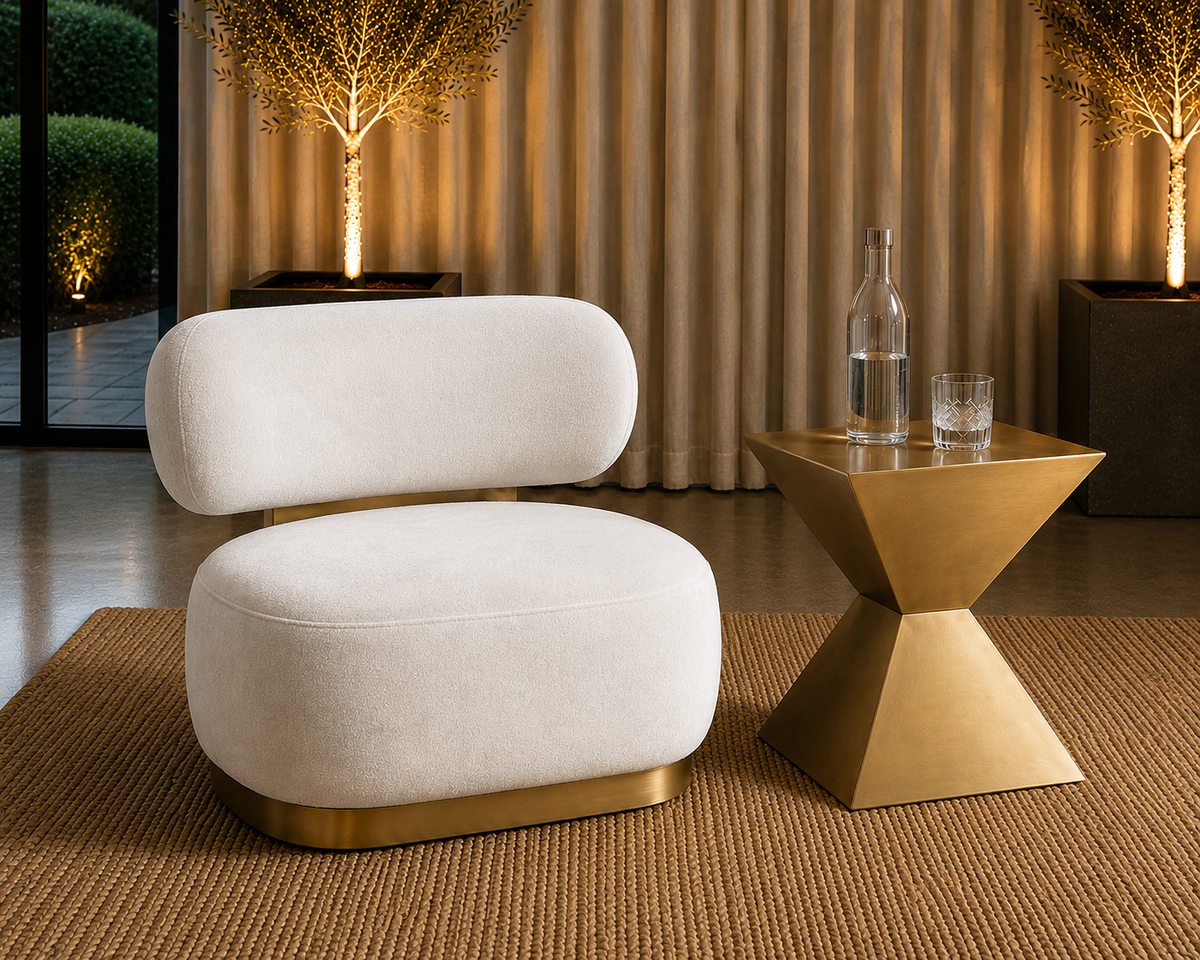 A Sienna armchair and gold side table in warm evening light